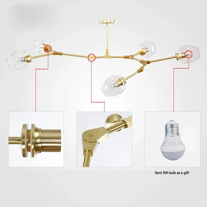 Modern gold glass pendant lights featuring clear glass globe shades and brass-finished arms for dining room lighting