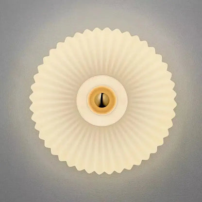 Cream-colored fluted ceiling light fixture with brass-toned socket for modern gold glass ripple led wall lamps bedroom decor