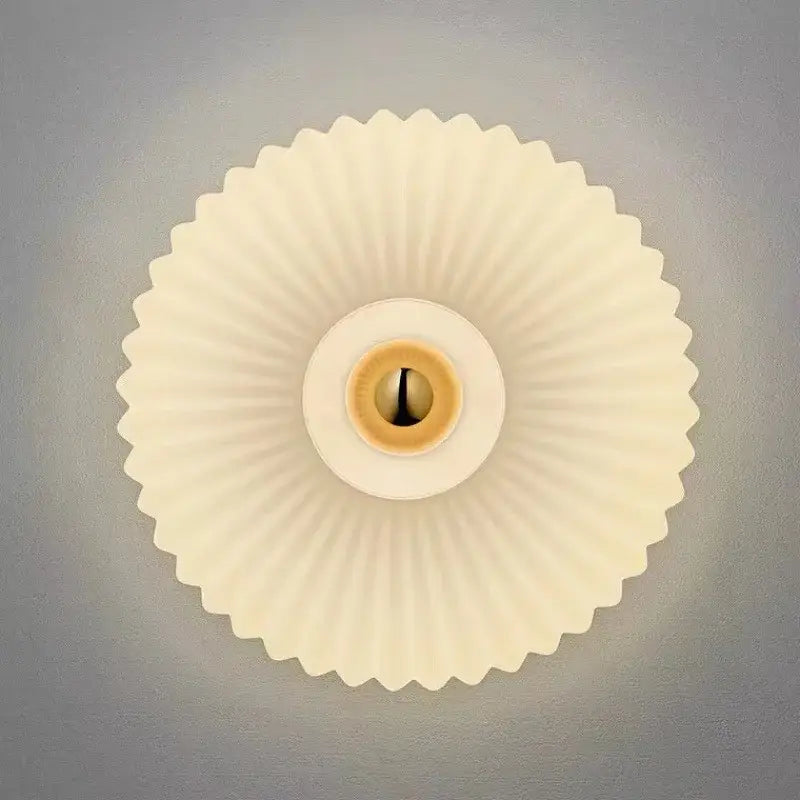 Cream-colored fluted ceiling light fixture with brass-toned socket for modern gold glass ripple led wall lamps bedroom decor