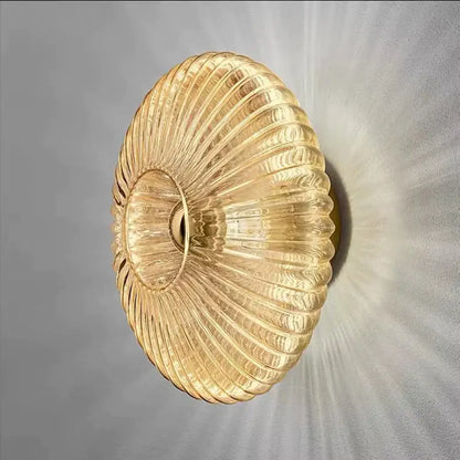 Modern gold glass ripple led wall lamp with ribbed design and warm glow for bedroom decoration