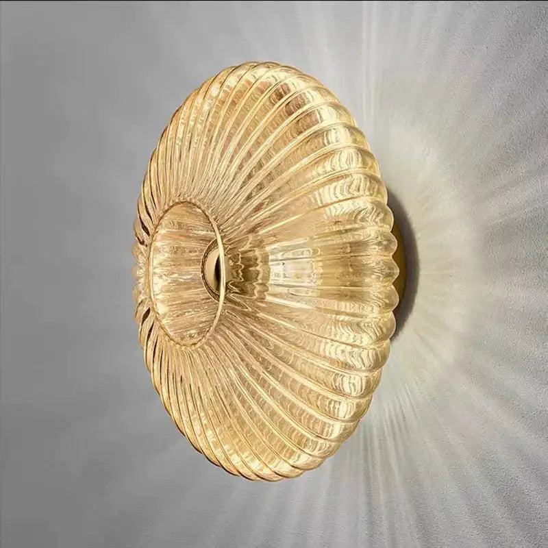 Modern gold glass ripple led wall lamp with ribbed design and warm glow for bedroom decoration