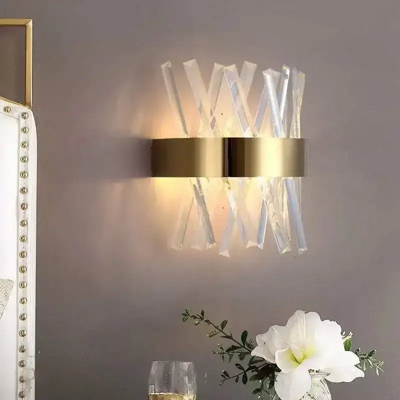 Modern gold wall sconce with sleek metal band and clear glass rod crystal rods for bedroom lighting