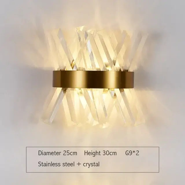 Modern gold wall sconce with clear glass rod crystal rods radiating from a circular stainless steel base for bedroom light