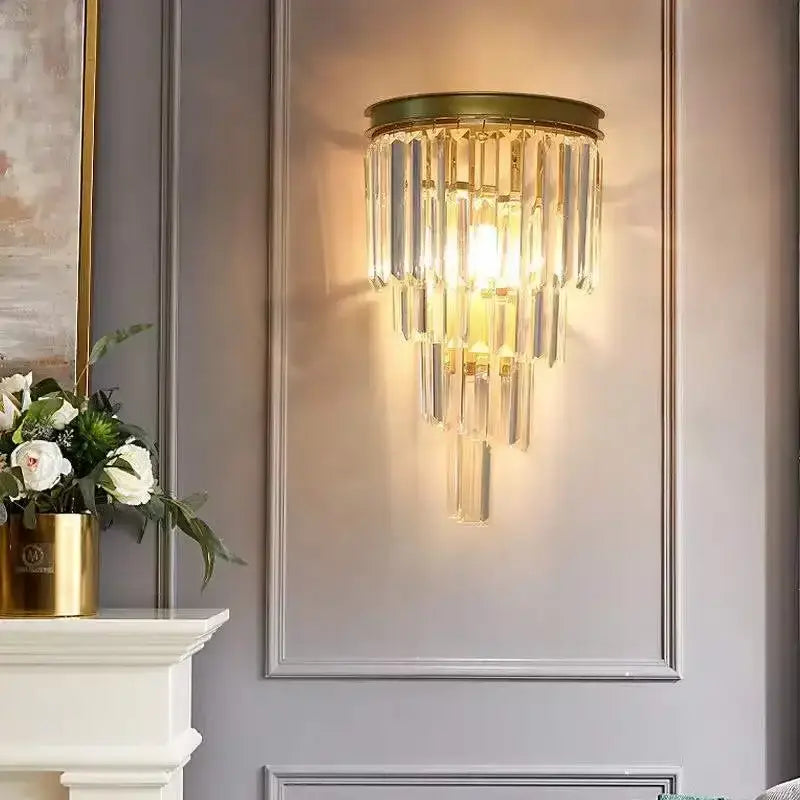 Modern gold wall sconce featuring cascading clear glass rod crystal rods ideal for bedroom lighting