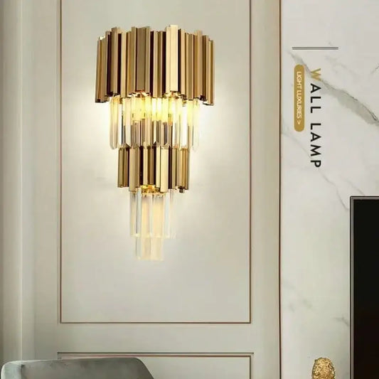 Modern gold wall sconce featuring glass rod crystal vertical bars and cascading clear crystal prisms for bedroom light