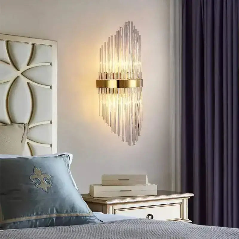 Modern gold wall sconce with vertical glass rod crystal design for bedroom lighting and sleek rod crystal wall decor
