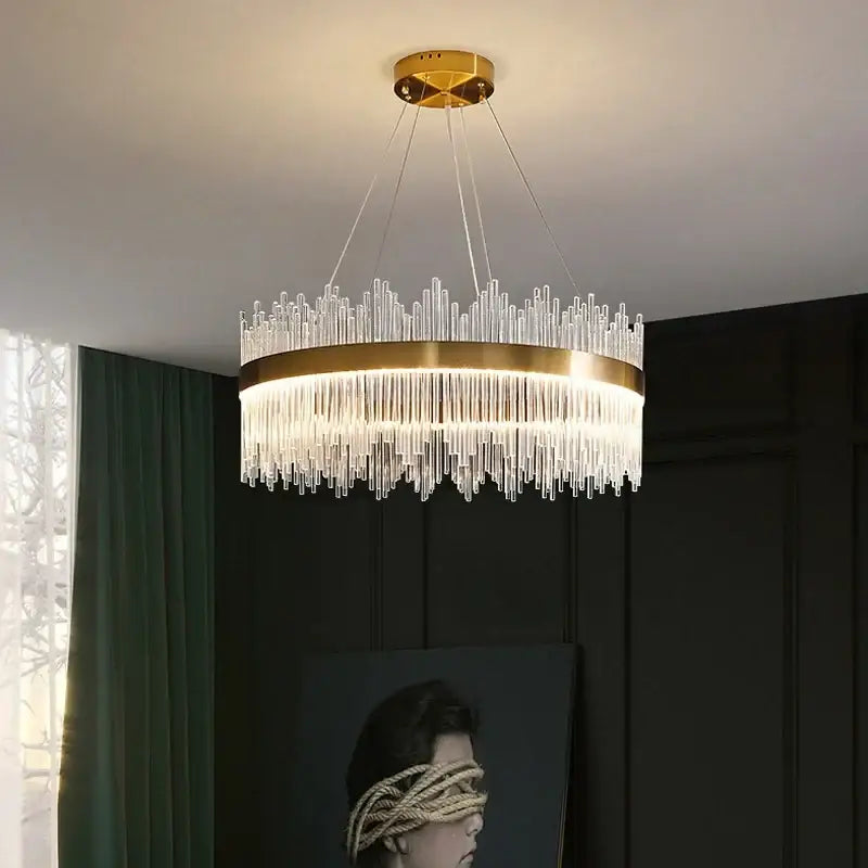 Modern gold pendant chandelier with glass rod led design and clear glass rods emitting warm light for dining room