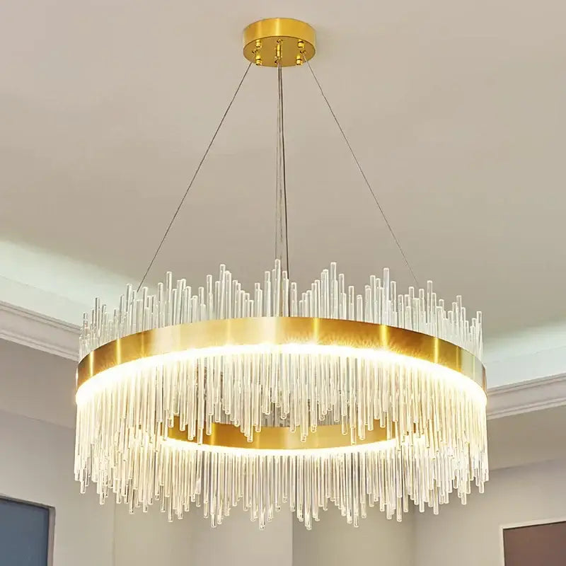 Modern gold pendant chandelier featuring a circular frame with clear glass rod led lights for dining room use