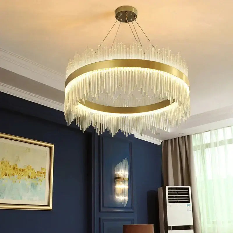 Modern gold glass rod led pendant chandelier with circular frame and cascading clear glass prisms for dining room