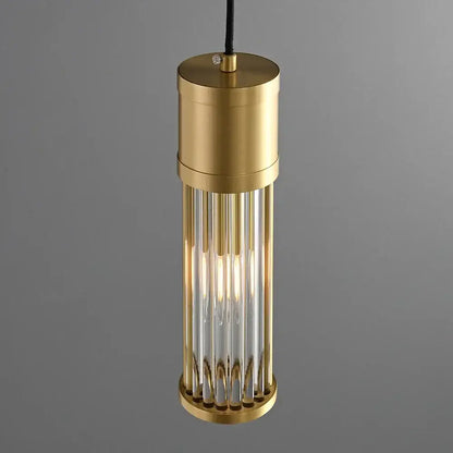 Modern gold glass shade pendant lights featuring brass cylindrical rods and a warm glow for kitchen island lighting