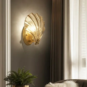 Modern gold glass shell led wall lamp with translucent panels and warm glowing light ideal for bedroom sconce lighting