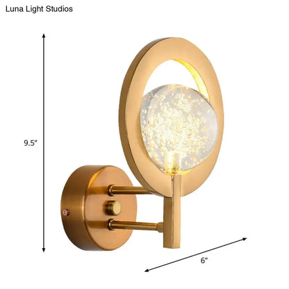 Modern gold globe wall lamp with clear crystal orb and floating light particles for bedroom 110v-120v use