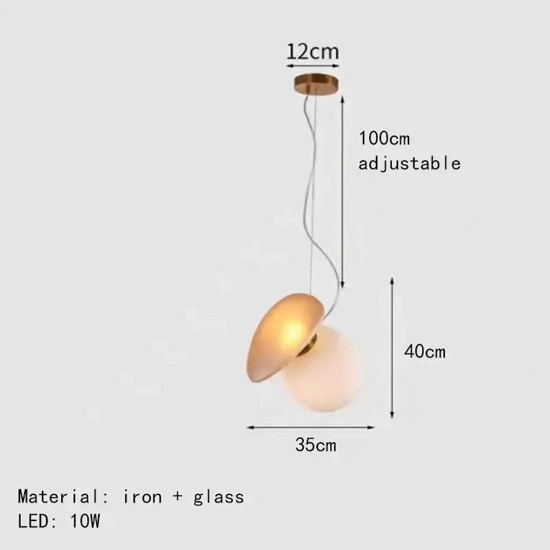 Modern gold and gray glass indoor pendant light with warm glowing glass shade and iron fixture for dining room decorbites pendant lights
