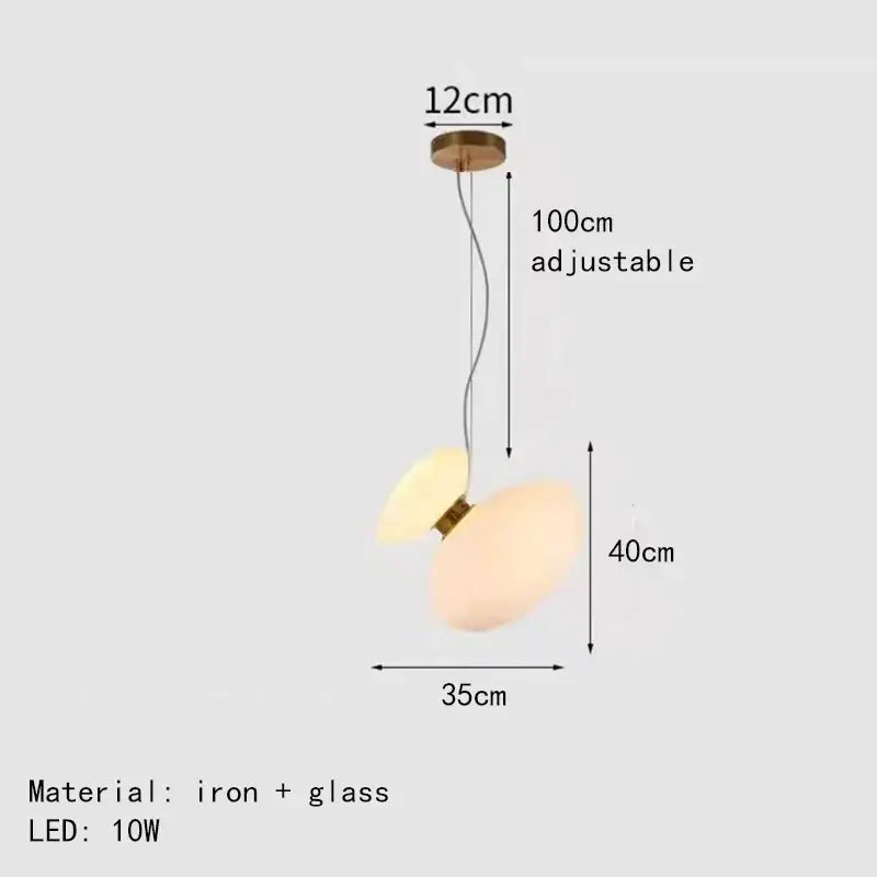 Modern pendant lights with two overlapping gray glass orbs and a brass iron fixture for dining room decorbites glass indoor use