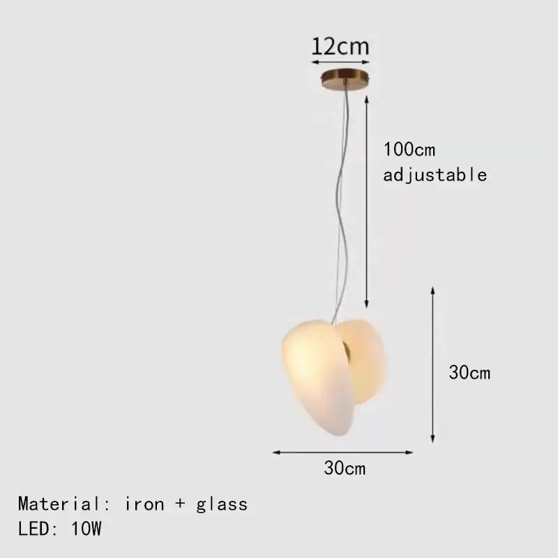 Modern gold and gray glass indoor pendant lights featuring a warm glowing glass shade and iron fixture for dining room decorbites glass indoor pendant