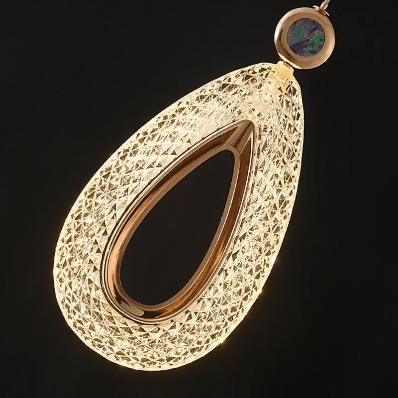 Modern gold heart led chandelier features a gold-toned geometric lattice pendant with an opal stone for decorbites heart led decor