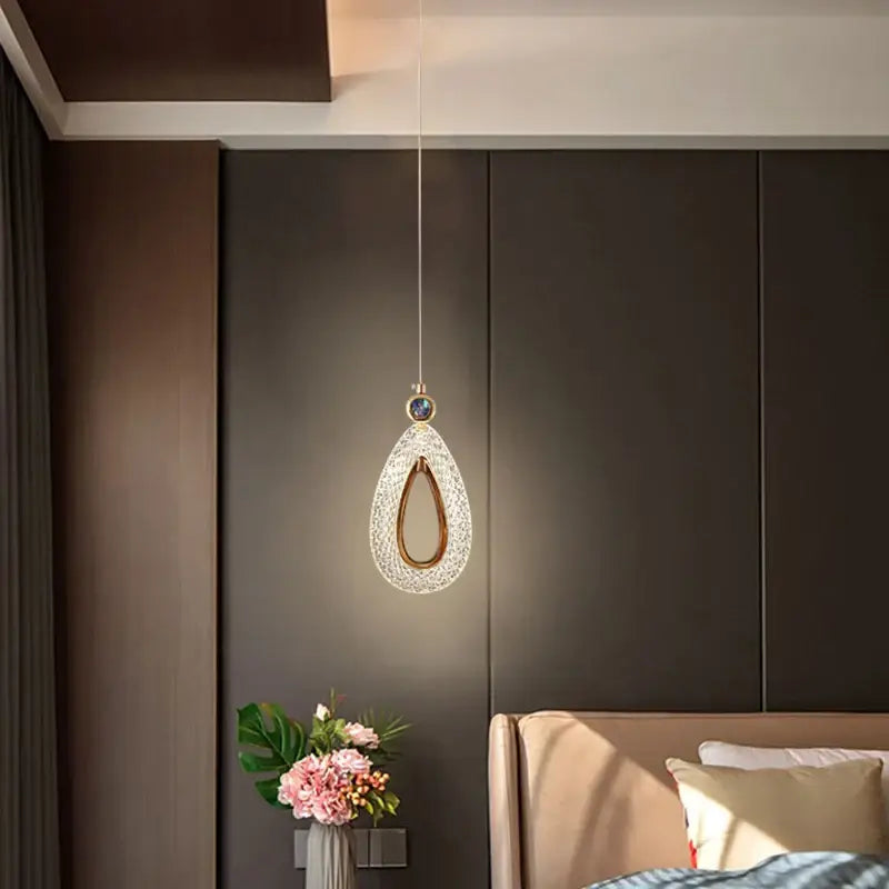 Modern gold heart led chandelier featuring a teardrop crystal pendant light with a gold-toned frame decorbites heart led