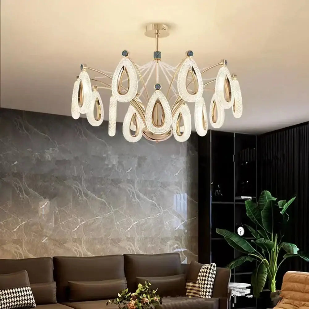 Modern gold heart led chandelier with translucent teardrop crystal rings on brass fixture for dining room decorbites heart led