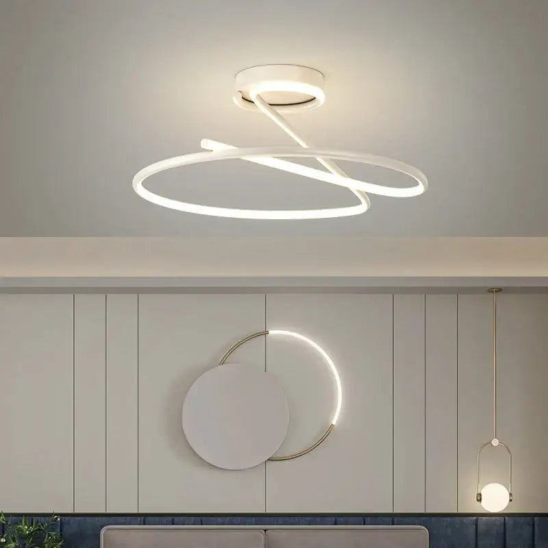 Modern gold heart line led chandelier featuring a sleek white intertwined circular line led design for bedroom ceilings
