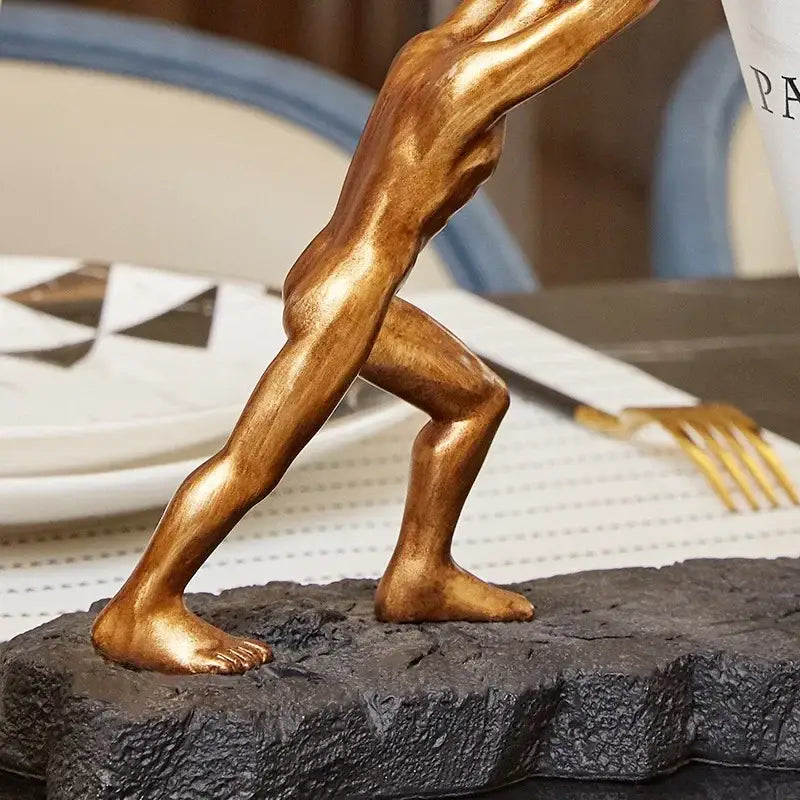 Modern gold hercules figurines wine rack featuring a golden bronze muscular male figure on black stone base decorbites hercules figurines