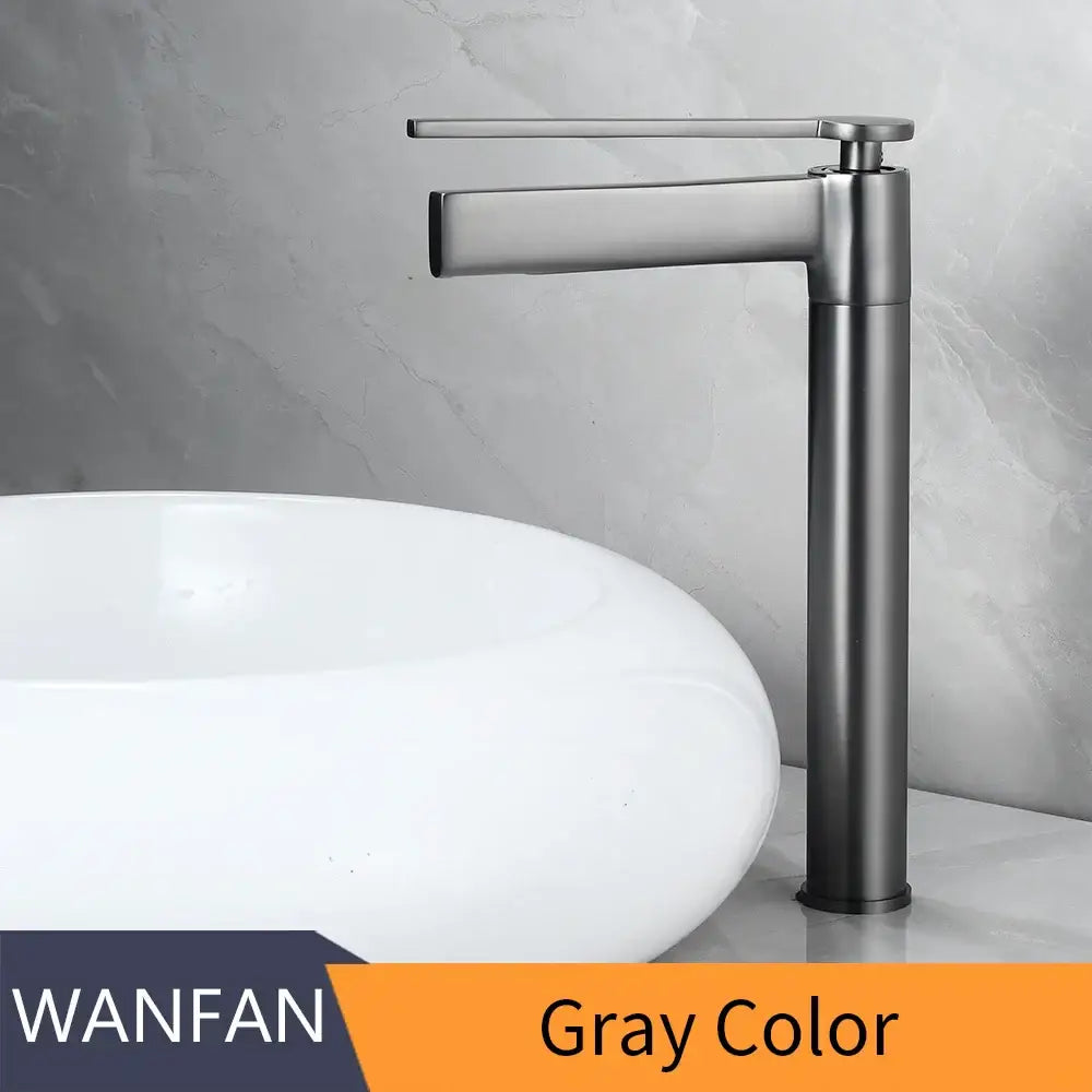 Gray metallic basin faucet with sleek modern design and tall cylindrical base for decorbites brass deck mounted use