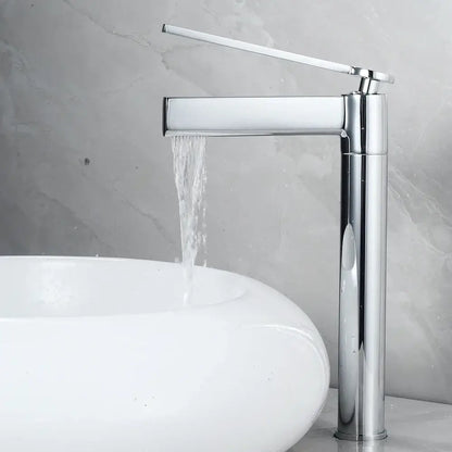 Modern chrome finished waterfall basin faucet with a sleek tall design and minimalist handle in decorbites brass deck mounted style