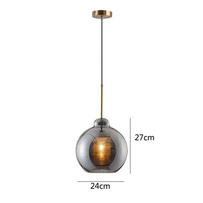 Modern gold honeycomb glass pendant lights featuring smoked glass globe and brass hardware ideal for dining room fixtures