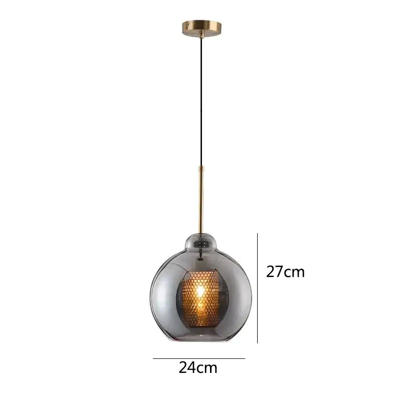 Modern gold honeycomb glass pendant lights featuring smoked glass globe and brass hardware ideal for dining room fixtures