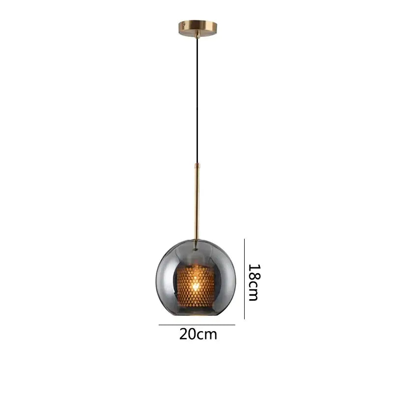 Modern gold honeycomb glass pendant lights featuring a spherical smoked glass pendant with brass rod for dining rooms