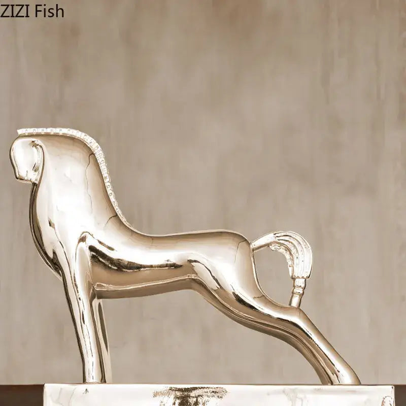 Shiny silver metallic horse resin sculpture with sleek design and decorative mane for modern living room decorbites horse