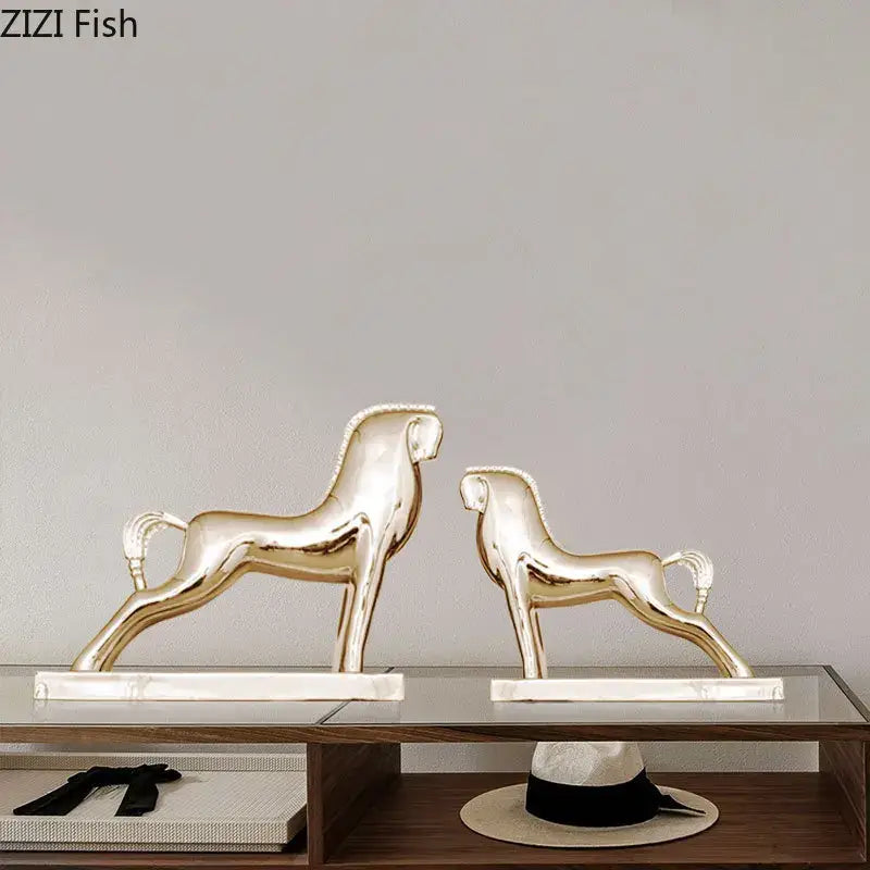 Two sleek gold-finished ceramic decorbites horse resin sculptures with minimalist design for living room decor