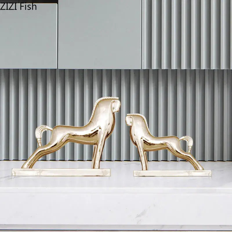 Two elegant gold-toned decorbites horse resin sculpture figurines with minimalist design for modern living room decor