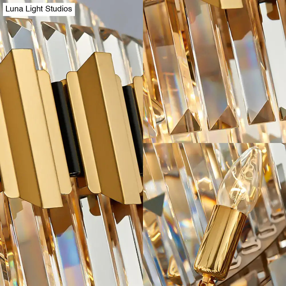 Modern gold icicle chandelier with faceted crystal prisms and warm glowing light bulbs for dining room pendant lighting