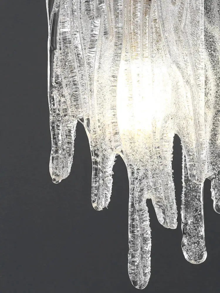 Modern gold icicle glass pendant light with transparent icicle glass and central glowing light for bedroom decorbites decor