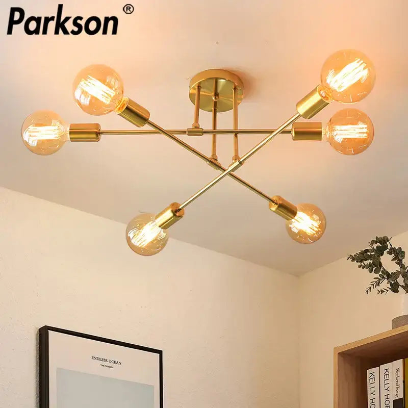 Modern gold industrial led ceiling light fixture with six exposed filament bulbs in geometric design for living room