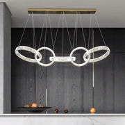Modern gold-toned decorbites crystal chandelier pendant light with clear faceted crystals for living room ceiling lighting