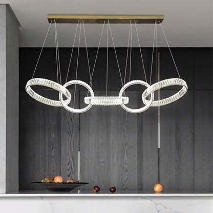 Modern gold-toned decorbites crystal chandelier pendant light with clear faceted crystals for living room ceiling lighting