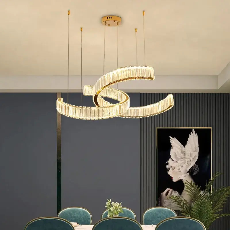 Modern gold-toned pendant lights with intertwined spiral design and embedded crystal rods by decorbites crystal led