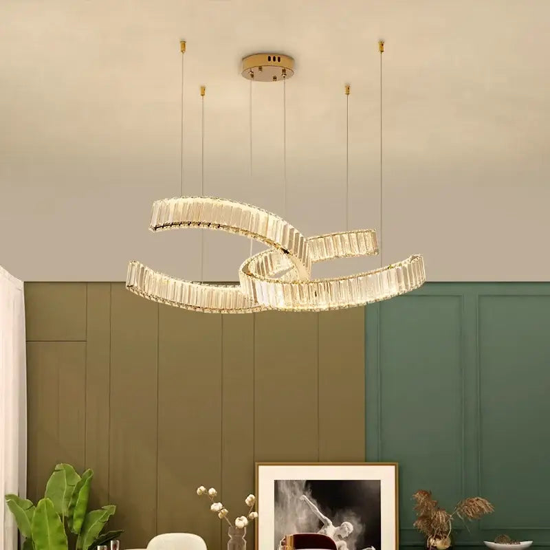 Modern gold-toned pendant lights with intertwined crystal led rings by decorbites for dining room dimmable decor