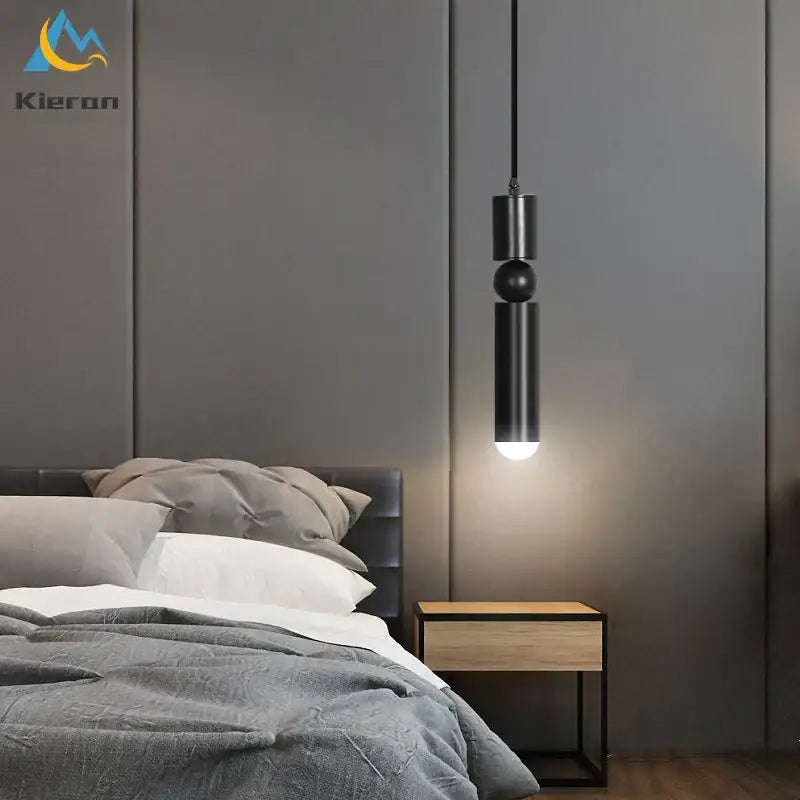 Modern gold iron art led pendant light with black matte cylindrical design and spherical accent for living room decorbites iron art
