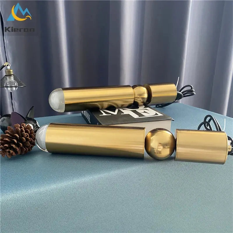 Two sleek gold iron art led pendant lights with cylindrical design and frosted glass ends for modern decorbites decor