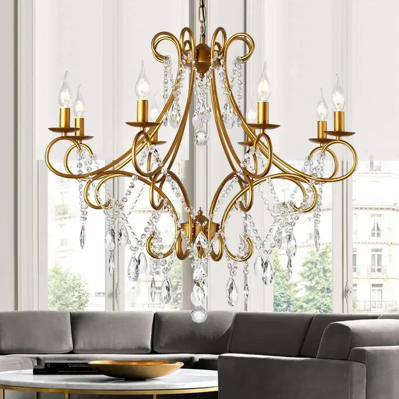 Modern gold iron crystal chandelier with intricate wrought iron arms and dangling crystal droplets for luxury dining room decorbites iron crystal lighting