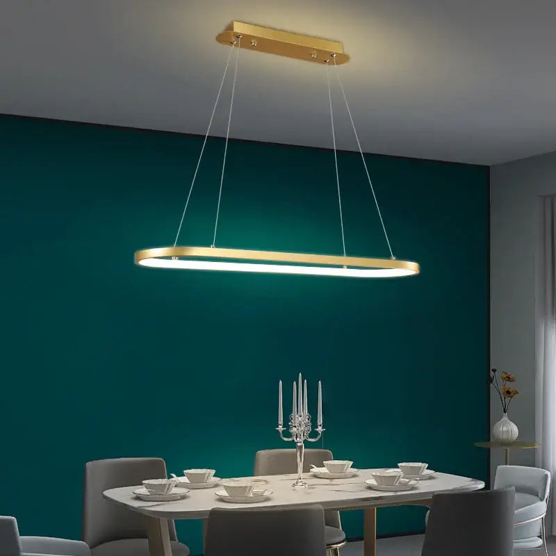 Modern gold iron dining chandelier ceiling lamp with oval pendant and thin suspension cords for kitchen decorbites iron dining