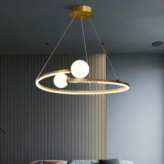 Modern gold iron led chandelier light with two glowing white spherical bulbs suspended by thin cords for living room decorbites iron led