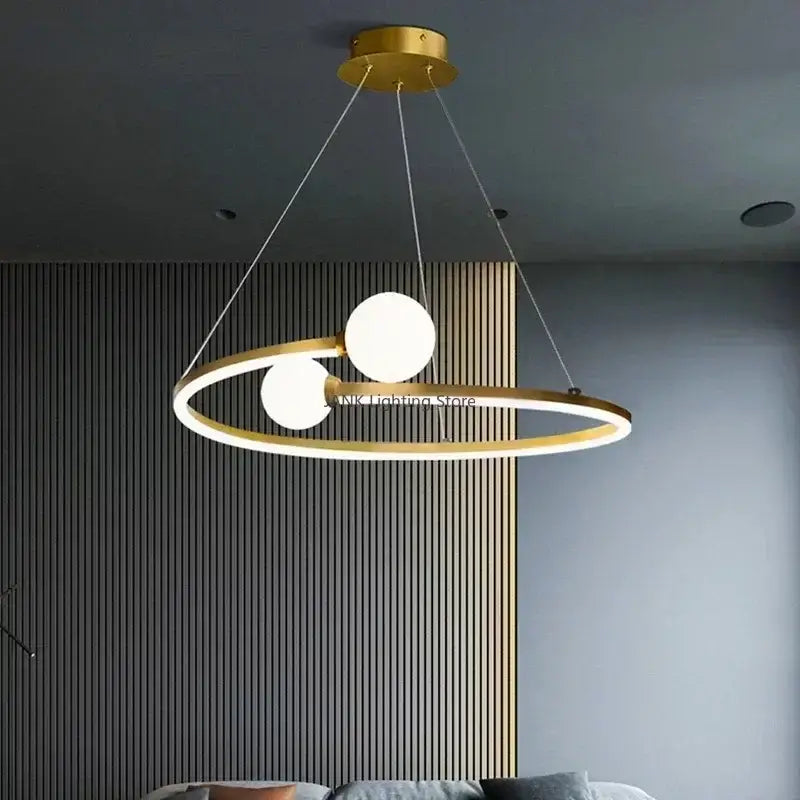 Modern gold iron led chandelier light with two glowing white spherical bulbs suspended by thin cords for living room decorbites iron led