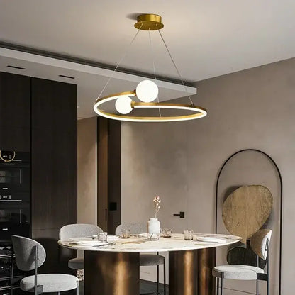 Modern gold iron led chandelier light featuring two glowing white bulbs in a sleek circular decorbites iron led frame