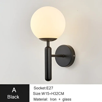 Modern gold iron led sconce lamp with textured black spherical glass globe and iron arm for bedroom decorbites iron led