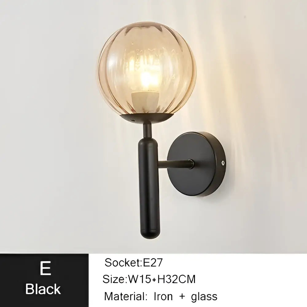Black wrought iron led sconce lamp with textured amber glass globe for bedroom decorbites iron led lighting