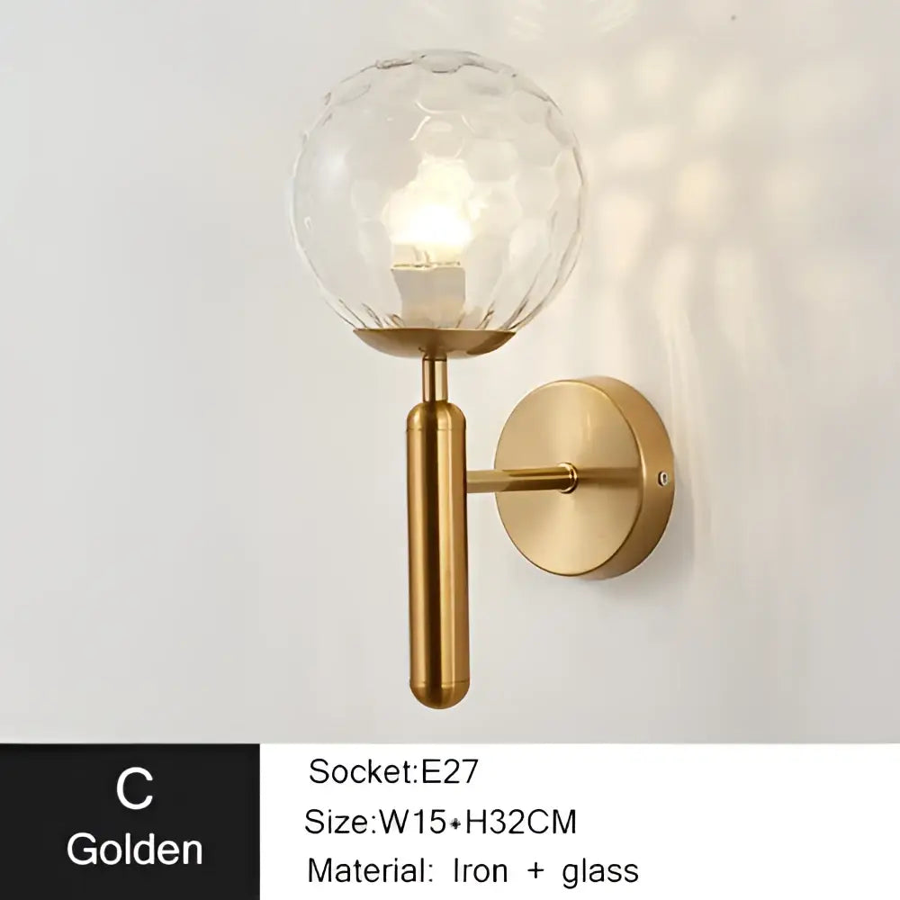 Modern gold iron led sconce lamp with textured spherical glass and brass-finished base for bedroom decorbites iron led