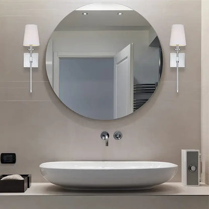 Round white bathroom mirror with chrome fixtures paired with modern gold iron led wall lamp white shade decorbites iron led wall